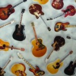 Guitars on light background fabric