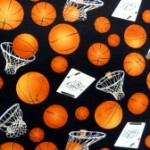 Basketballs on black quilting fabric 