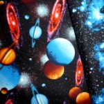 Planets on stars on black quilting fabric 