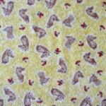 Rabbits on yellow quilting fabric