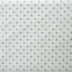 Green small spots on white fabric